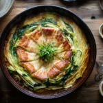 A beautifully arranged Mille-Feuille Nabe hot pot with layers of napa cabbage and pork belly in a Japanese donabe, steaming in rich dashi broth.