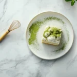 A luxurious spread of matcha desserts, including matcha tiramisu, cheesecake, and cookies, elegantly arranged on a marble countertop with a tea whisk and matcha powder.